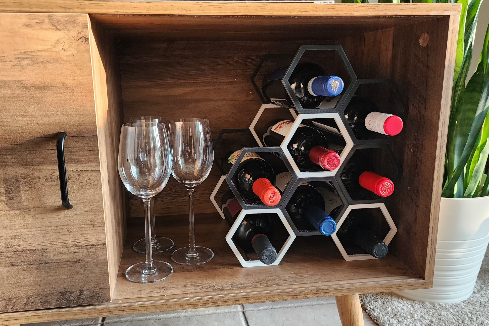Wooden cabinet converted to a beautiful minimalist wine rack using VinoStack modular wine rack.